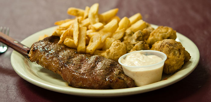 Flat Iron Steak with Fries and fried mushrooms